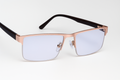 Stylish Rose Gold and Black Eyewear with Transparent Lenses